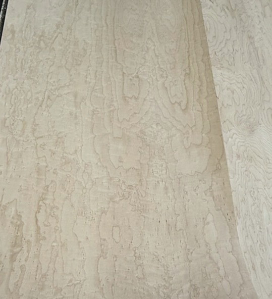 Different coloring on sheets of Birdseye veneer