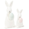 Set of 2 White Stoneware Easter Bunny Figurines Holding Colored Eggs from Primitives by Kathy