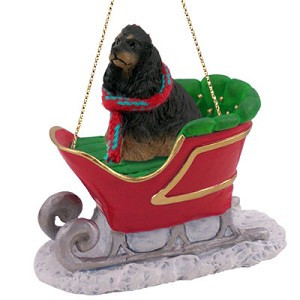 Black & Tan Cocker Spaniel Dog in Sleigh Christmas Ornament