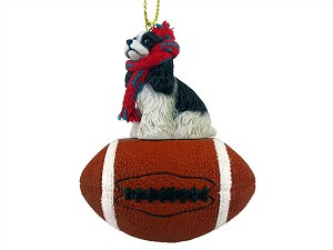 Black & White Cocker Spaniel Dog on Football Christmas Ornament – Hand-Painted Stone Resin