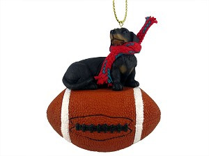 Black Dachshund Dog on Football Christmas Ornament – Hand-Painted Stone Resin