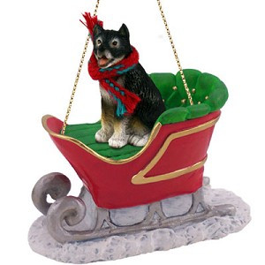 Black and white Alaskan Malamute Dog in Sleigh Christmas Ornament