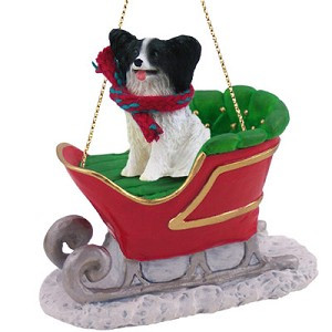 Black & White Papillon Dog in Sleigh Christmas Ornament