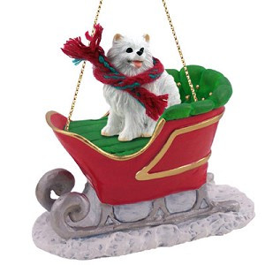 Miniature American Eskimo Dog in Sleigh Christmas Ornament