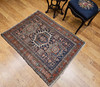 Antique Heriz Karajeh area rug, circa late 1800s, with navy field, geometric medallions in pale green and ivory, and a rust-red border, The Persian Knot Gallery, SKU 1358