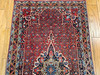 Vintage Persian Bidjar (Bijar) gallery rug with rust red Herati field, navy border, and floral medallion design, early 20th century hand woven carpet.
