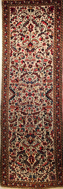 Vintage Persian Heriz runner, mid-20th century, with an all-over geometric large leaf design on an ivory background, in bright colors of blue, pink, red, yellow, green, French blue, baby blue, and olive green.
