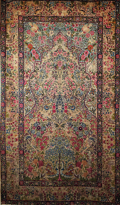 Vintage Persian Kerman Lavar Tree of Life rug with birds and floral motifs in navy, turquoise, red, and sage – early 20th century