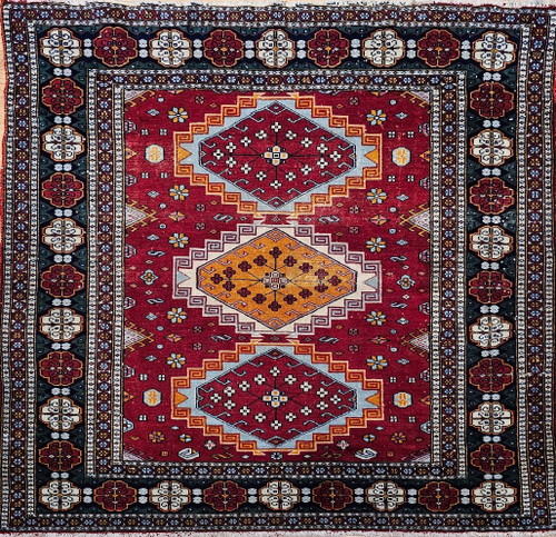Mid-20th Century Vintage Persian tribal area rug. Hand-knotted. Highly rare square size. Triple medallion design. Brilliant red background. Medallions in red and yellow. Accent colors in royal blue, yellow, and navy. Dark green border with red and ivory medallions. Soft wool pile on a cotton foundation.