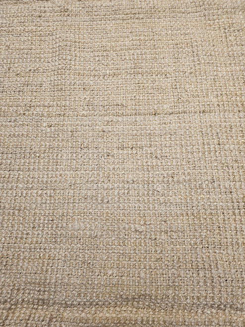 Oversize handwoven natural fiber jute rug in light ivory with braided weave and textured surface, handmade and durable, The Persian Knot Gallery, SKU 2311