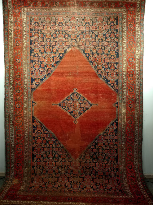 Late 19th Century Antique Persian Malayer room size rug. Hand-knotted. Terracotta red field with a large medallion and a smaller central navy blue medallion. Herati design in navy blue, baby blue, and red. Red major border with branches and flowers in nav