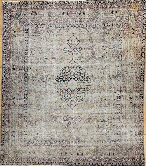 Late 19th Century Antique Persian Kerman Lavar area rug. Handwoven. Rare near-square size. Floral central medallion on ivory background. Scrolling vines and flowers in black and red throughout field. Five borders with floral designs in black, red, and cream. Weaver's signature in top border.