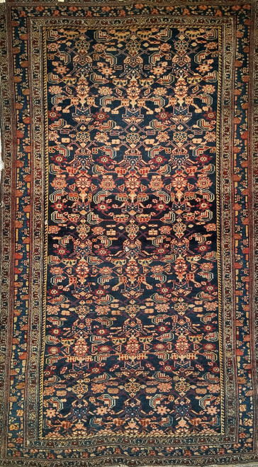 Early 20th Century Vintage Persian Senneh area rug. Hand-knotted. All-over "Herati" pattern on abrash navy blue background. Extremely fine weave, high knot density. French blue border with geometric pattern. Accent colors: red, yellow, ivory. Early 20th Century Vintage Persian Senneh area rug. Hand-knotted. All-over "Herati" pattern on abrash navy blue background. Extremely fine weave, high knot density. French blue border with geometric pattern. Accent colors: red, yellow, ivory.