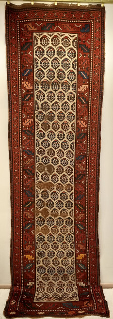 Late 19th Century Antique Persian Bidjar runner. Hand-knotted. All-over paisley variation/flower head pattern on light cream/ivory field. Brick color border with leaf design in red, green, blue, pink. Major border in navy background with colorful geometri