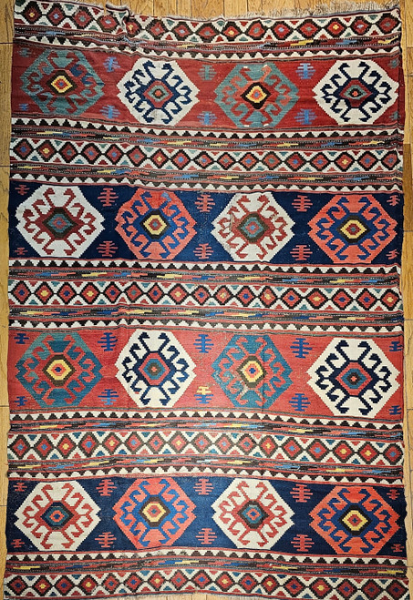 19th Century Vintage Caucasian Kazak room size kilim. Hand-woven flatweave. Striped pattern with hooked diamond designs in each band. Over 125 years old. Good condition. Colors: blue, green, pink, ivory, navy, yellow. Made with organic vegetable dyes.