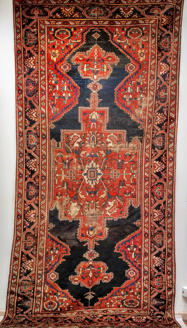 Antique Persian Farahan gallery rug with terracotta medallions on navy blue field and geometric border, late 19th century handwoven rug. The Persian Knot Gallery, SKU 1005