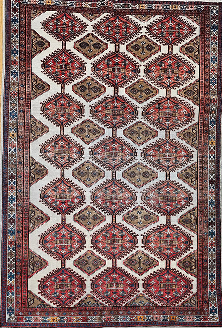 Vintage Persian Malayer room size or gallery rug. Hand-knotted. All-over geometric pattern. Ivory color background. Three columns of larger connected medallions, two columns of smaller medallions. Primary field color white with medallions in red, brown, green. Primary border white with geometric designs in green, yellow, blue, brown. Includes camelhair.