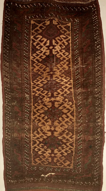 Small Baluch prayer rug with cream and dark green tribal design, handwoven in Southwest Persia.