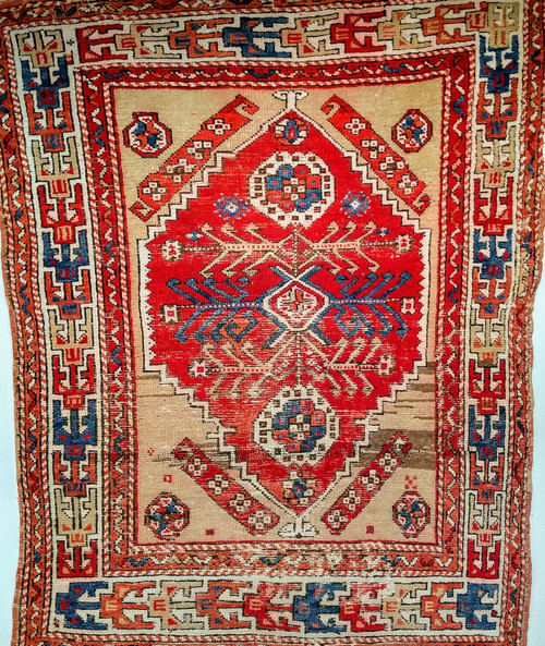 19th century Turkish Anatolian rug with red central medallion, beige field, and geometric Caucasian-style border, The Persian Knot Gallery, SKU: 1592