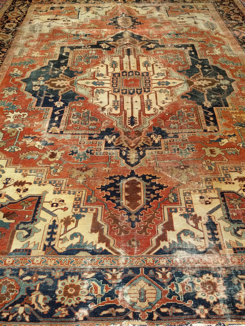 Mid-19th Century Antique Persian Serapi area rug. Hand-woven. Uncluttered open design. Rust-red field. Rare ivory central medallion and spandrels. Made with bright natural dyes. Over 150 years of age.