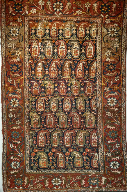 Antique Kurdish rug with paisley motifs and colorful red border with abrash from natural dyes, The Persian Knot Gallery, SKU 1048, 4’ x 6’ 4”, 4th Quarter of the 1800s