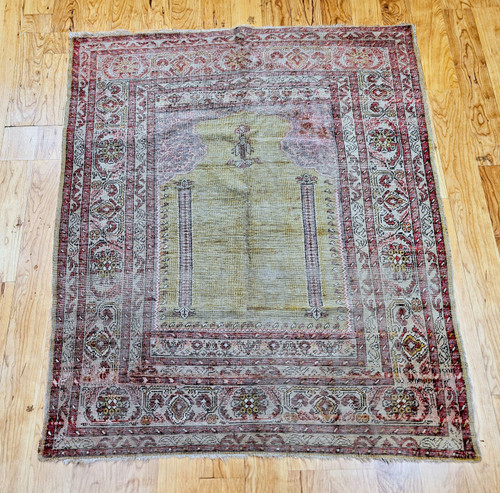Vintage Anatolian Turkish prayer rug in pale yellow with blue and pink accents, late 1800s handwoven design. Vintage Anatolian Turkish prayer rug in pale yellow with blue and pink accents, late 1800s handwoven design.