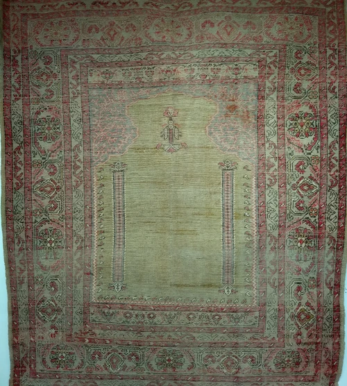 Vintage Anatolian Turkish prayer rug in pale yellow with blue and pink accents, late 1800s handwoven design.