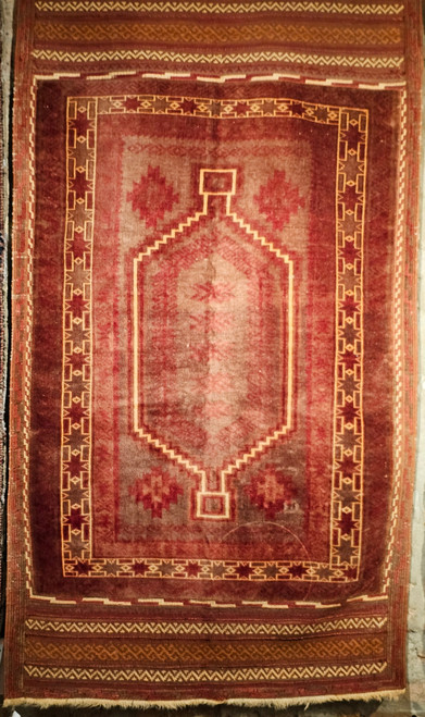 Early 1900s Baluch tribal area rug with shimmering fine wool, allover design, and kilim ends.