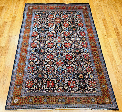 Vintage Persian Tabriz Afshan rug with geometric Caucasian Kuba pattern in navy, red, and multicolor accents
