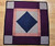 Antique Amish Crib Quilt | Diamond in a Square Lancaster County | Full View on Floor