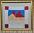 Vintage American Embroidered Crib Quilt | House Motif Framed | In-Room View 2