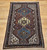 Antique Persian Qashqai Tribal Rug 4x6 | Triple Medallion | Full View on Floor