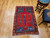 Mid 19th century Turkish Anatolian rug with red field and green and blue accents in a prayer design format, The Persian Knot Gallery, SKU: 1590