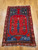 Mid 19th century Turkish Anatolian rug with red field and green and blue accents in a prayer design format, The Persian Knot Gallery, SKU: 1590