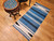 Vintage American Southwestern area rug with Persian blue striped field and ivory and black accents, handwoven wool flat weave, @thepersianknot  , SKU 2165