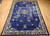 Antique Chinese Peking Rug 10x13 | Indigo Foo Dog | Full View on Floor