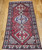 Vintage Persian Shiraz Rug 5x10 | Three Medallion Red | Full View on Floor
