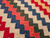 Early 1900s American Pieced Quilt with hand-stitched sawtooth square pattern and colorful calico cotton prints, The Persian Knot Gallery, SKU: 2308