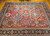 Vintage Persian Mahal Sultanabad rug with an allover geometric pattern in brick red and navy blue, accented with blue, pink, green, brown, and yellow, The Persian Knot Gallery, SKU: 2319