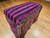 19th century Caucasian Karabagh Soumak Mafrash tribal cargo bag with four panels and kilim base in red, yellow, pink, and purple, The Persian Knot Gallery, SKU: 2334