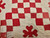 19th century Irish Chain hand-stitched pieced cotton quilt with red square pattern on an ivory background, antique American folk textile, The Persian Knot Gallery, SKU: 2346