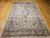 Vintage Indian hand-knotted silk rug with floral medallion design, ivory background, dark green border, pale blue spandrels, and multicolor accents, The Persian Knot Gallery, SKU: 2357