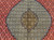 Vintage Persian Tabriz Mahi rug. Hand-knotted. Fine wool pile with silk accents. Geometric diamond pattern in alternating red and ivory. Richly detailed field. Burgundy border with shades of lavender, blue, and brown.