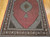 Vintage Persian Tabriz Mahi rug. Hand-knotted. Fine wool pile with silk accents. Geometric diamond pattern in alternating red and ivory. Richly detailed field. Burgundy border with shades of lavender, blue, and brown.