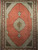 Vintage Persian Tabriz Mahi rug. Hand-knotted. Fine wool pile with silk accents. Geometric diamond pattern in alternating red and ivory. Richly detailed field. Burgundy border with shades of lavender, blue, and brown.