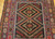 Mid-20th Century Vintage Afghan Baluch tribal area rug. Hand-knotted. Near square size. Geometric design in red and brown. Soumak kilim weaving incorporated in design.