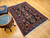 Vintage Persian Malayer rug with allover geometric pattern in navy, French blue, green, pink, and red – early 1900s hand-knotted rug with natural abrash and floral border.