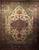 Late 19th-century Turkish Heriz Serapi rug with pale yellow field, green medallion, and dark blue border, The Persian Knot Gallery, SKU 1531