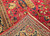 Vintage Persian Kerman Lavar in "Tree of Life" pattern with floral design set in an ivory color field from the first half of the 20th century.  There are several beautiful designs that are incorporated in this rug including a row of cypress trees on the lower part of the rug.  Also the range of the colors in the design include green, gold, blue, and red.  The corner spandrels on the upper section of the design are in a bright red color with floral design.  The primary border is also in ivory color with flowers and tree designs throughout.