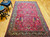 Vintage Persian Kerman Lavar in "Tree of Life" pattern with floral design set in an ivory color field from the first half of the 20th century.  There are several beautiful designs that are incorporated in this rug including a row of cypress trees on the lower part of the rug.  Also the range of the colors in the design include green, gold, blue, and red.  The corner spandrels on the upper section of the design are in a bright red color with floral design.  The primary border is also in ivory color with flowers and tree designs throughout.